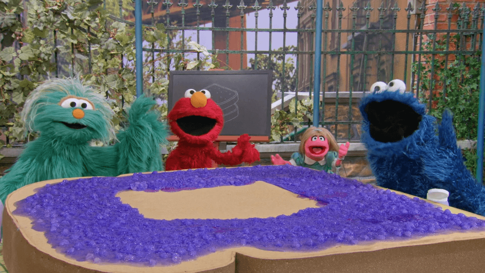 Prairie Dawn, Elmo, Cookie Monster, and Rosita make a special sandwich for Snuffy.