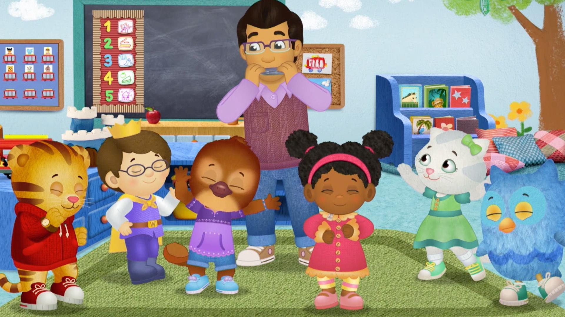 Mr. Malik teaches the children about hermit crabs./Daniel and Katerina play in the snow.